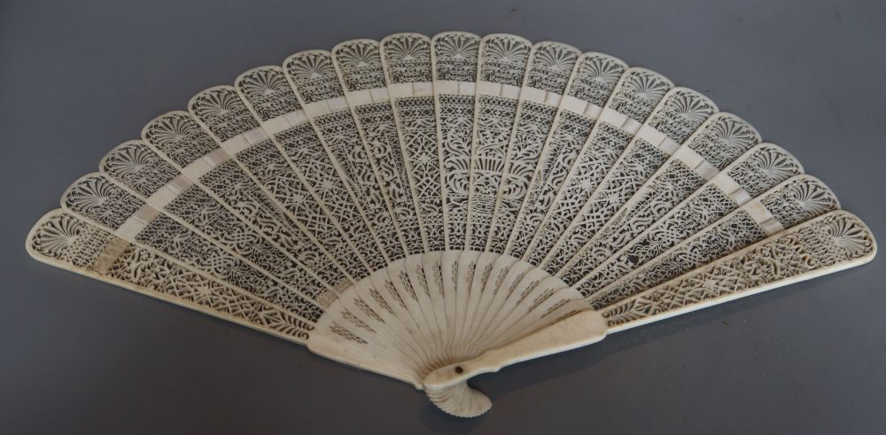 A 19th century French pierced ivory brise fan, length 28cm